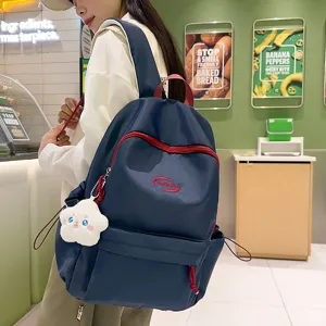 Mochila escolar de moda para adolescentes azul oscuro con detalles rojos y colgante de felpa nube