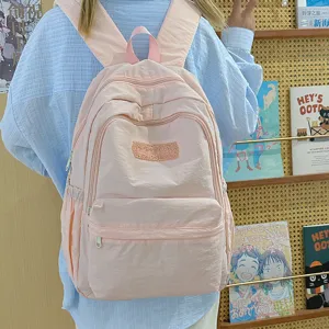 Ins style pink school backpack for girls, lightweight casual daypack for student daily commute.