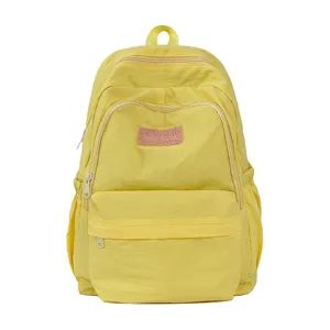 Yellow casual school backpack for women, lightweight minimalist ins style student bag.