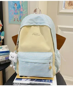 Detailed view of the Japanese style plaid backpack with spacious compartments and front pocket.