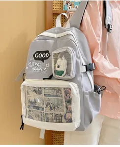Mochila ita gris con ventana transparente para pines y peluche, espaciosa bolsa escolar.
