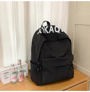 Black canvas backpack detail view, Korean casual style daily school bag with letter print