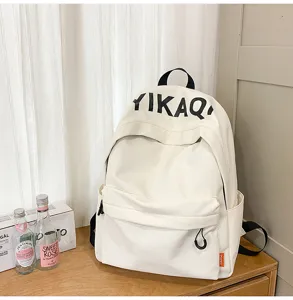 Korean lazy style canvas backpack, minimalist student bookbag with front pocket and shoulder straps.