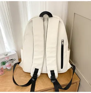 White casual backpack for women, Korean style school bag with back straps and zipper pocket.