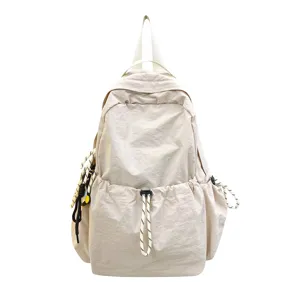 Solid color nylon backpack for women, large capacity casual school bag and travel daypack.