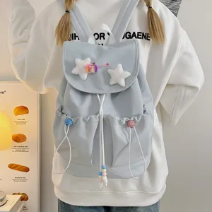Light blue canvas backpack with cute fluffy star decor and drawstring closure for daily use