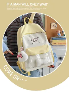 Cute college style yellow and white transparent backpack ita bag with adorable plush charms.