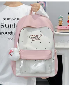 Cute sweet pink white school backpack with transparent front pocket, bow plush pendant and polka dots.