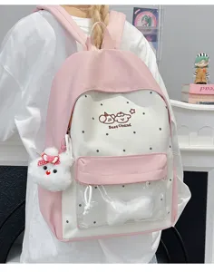 Cute college style pink and white school backpack with transparent front pocket and cute plush pendant.