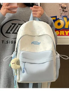 Blue and white star school backpack with cute moon plush pendant for student casual use.