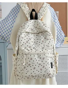 Casual corduroy backpack for women, cute bow heart print school bag for daily travel use.