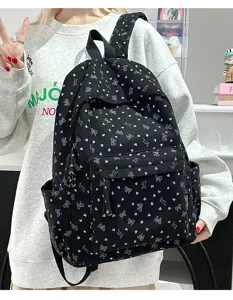 Black corduroy backpack with cute heart and bow print, casual school bag for daily use.
