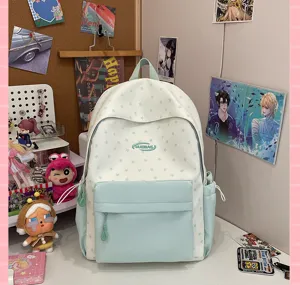 Cute mint green star print canvas backpack for school girls, casual aesthetic student daypack.