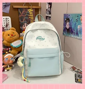 Fresh student backpack featuring a cute star pattern, front pocket, and charming pendant details.