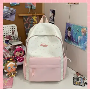 Pink and white star student backpack close up detail, canvas school bag for daily use.