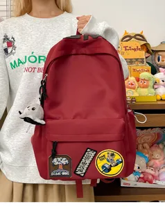 Large capacity casual canvas backpack with cute patches and pendant for school daily use.