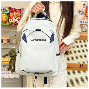 Detailed view of the lightweight waterproof school backpack with blue contrast and pockets.