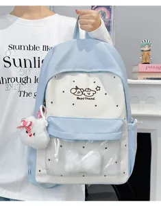 Detail view of cute pastel blue polka dot ita backpack with transparent front window pocket.