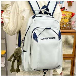 Large capacity casual school backpack for women, stylish travel daypack with cute frog pendant.
