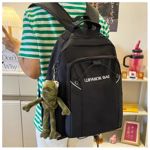 Casual black backpack large capacity school bag with cute frog pendant for students daily use