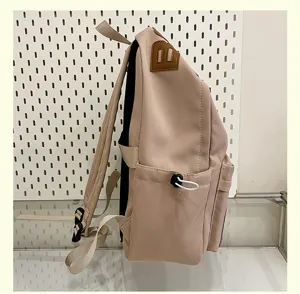 Casual canvas backpack side view large capacity school bag for daily travel and students.