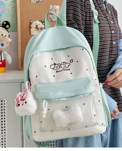 Cute preppy style polka dot canvas backpack with transparent pocket and plush bow for students.