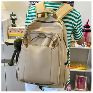 Detail shot of a casual canvas backpack featuring multiple storage pockets and sturdy straps.