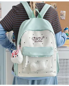 Cute school backpack with clear front pocket and plush charm, ideal for daily student use.