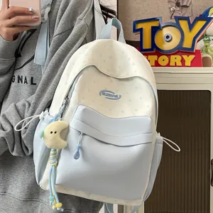 Cute star pattern school backpack for teen girls, refreshing casual daypack with cute pendant.
