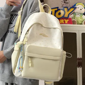 Casual canvas school backpack for teen girls, cute star pattern daypack with front pocket.