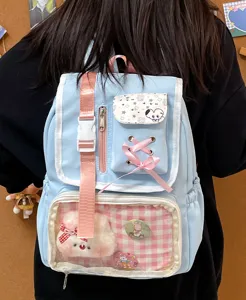 Japanese style cute light blue it bag backpack with clear window, pink straps and bow.