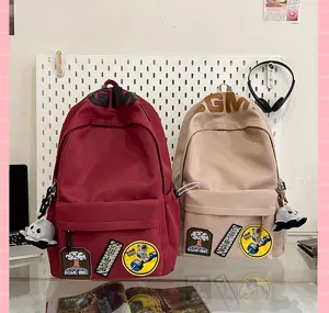Durable large capacity casual school backpack featuring cool patches and chic design details.