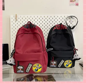 Korean style high capacity student backpack casual school bag with cute patches and pins.