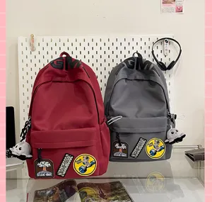 Korean style high capacity backpack for students, trendy dual color school bag with chic patches.