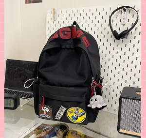 Korean style black canvas backpack for school students with large capacity and cute patches.