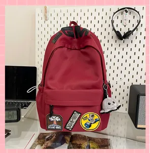 Red student canvas backpack detail showcase, large capacity casual daypack with cute patches.