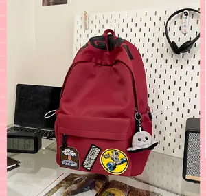 Red canvas student school backpack casual daily book bag with cute patches and pendant.
