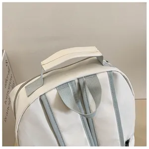 Casual minimalist waterproof school backpack for women, large capacity travel bag.