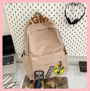 Korean style ins aesthetic large capacity beige school backpack with cute patches and laptop detail.