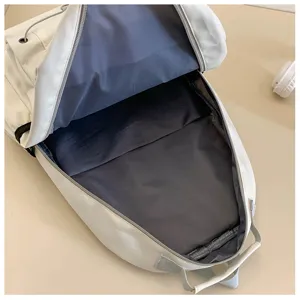 Detailed interior view of a spacious casual white school backpack with smooth zipper.