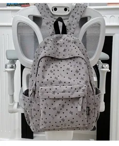 Corduroy backpack detail, grey school book bag with cute heart print and front pocket.