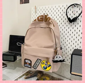 Ins style casual canvas backpack for students, large capacity beige school bag with patches.