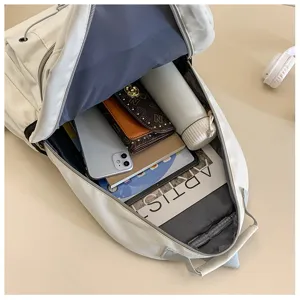 Large capacity white travel backpack daily school bag with multiple compartments for student.