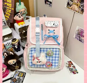 Japanese style pink ita bag backpack with clear PVC pocket and cute bow for anime fans.