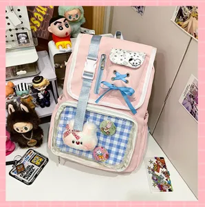 Pink Japanese style canvas pain bag with clear window, cute bow, and badge display area.