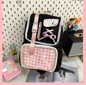 Japanese style black ita bag backpack with pink bow, clear display window for pins and merch.
