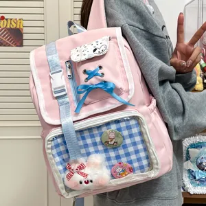 Pink Japanese style ita backpack with clear window, cute plush pendant and ribbon