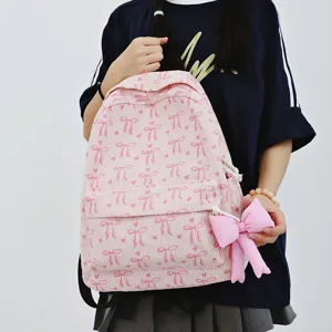 Japanese style pink corduroy backpack with cute bow prints and lovely pendant for women daily use