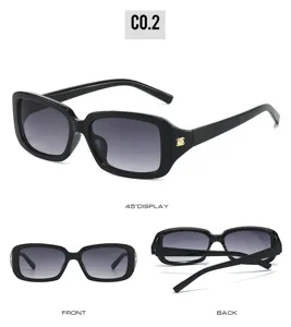 Trendy black rectangular sunglasses with gradient lenses and elegant camellia temple accent.