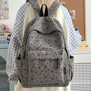 Corduroy backpack for women and girls, cute bow print casual daypack for school and travel.